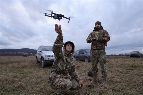 The footage appears to show the unmanned military flyer dropping. . Ukrainian drones drop grenades on russian soldiers